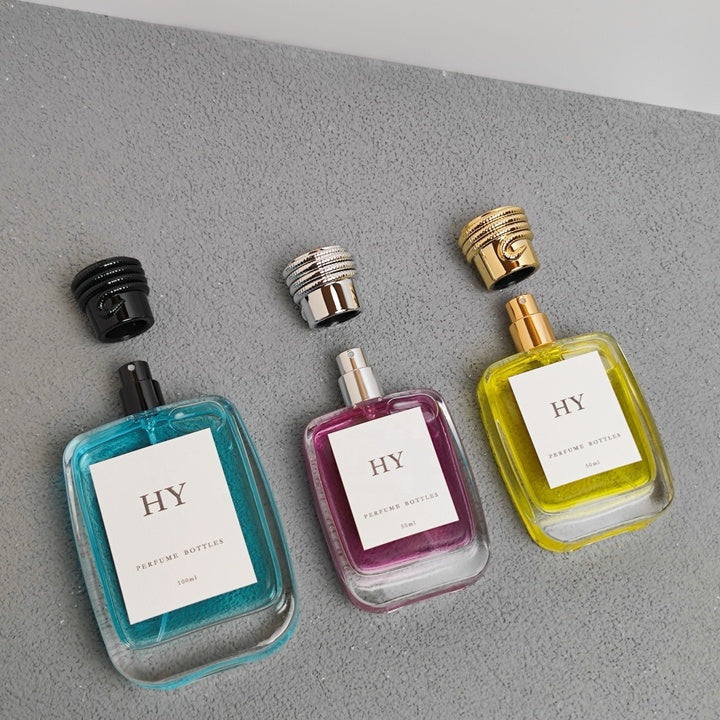 Luxury 50ml 100ml Stock Heavy Base Flat Glass Perfume Spray Bottles with Bold Snake Caps and Pump Sprayer Crimp Neck Design