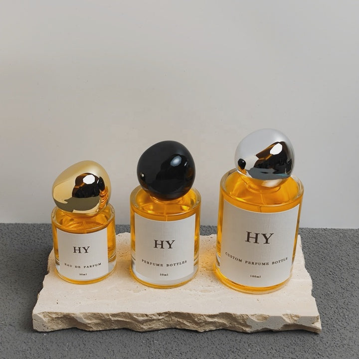 Minimalist 30ml 50ml 100ml Cylinder Glass Perfume Atomizer Bottle Customizable with Stone Shape Cap