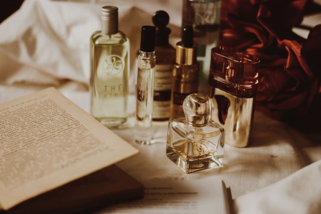 Perfume bottles of several different brands placed on a carefully decorated tablecloth