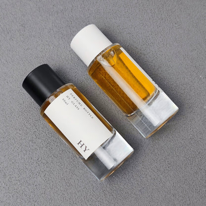 Custom 80ml Luxury Glass Transparent Cylinder Perfume Bottle Minimalist Black White Caps Screen Printing Pump Sprayer Wholesale