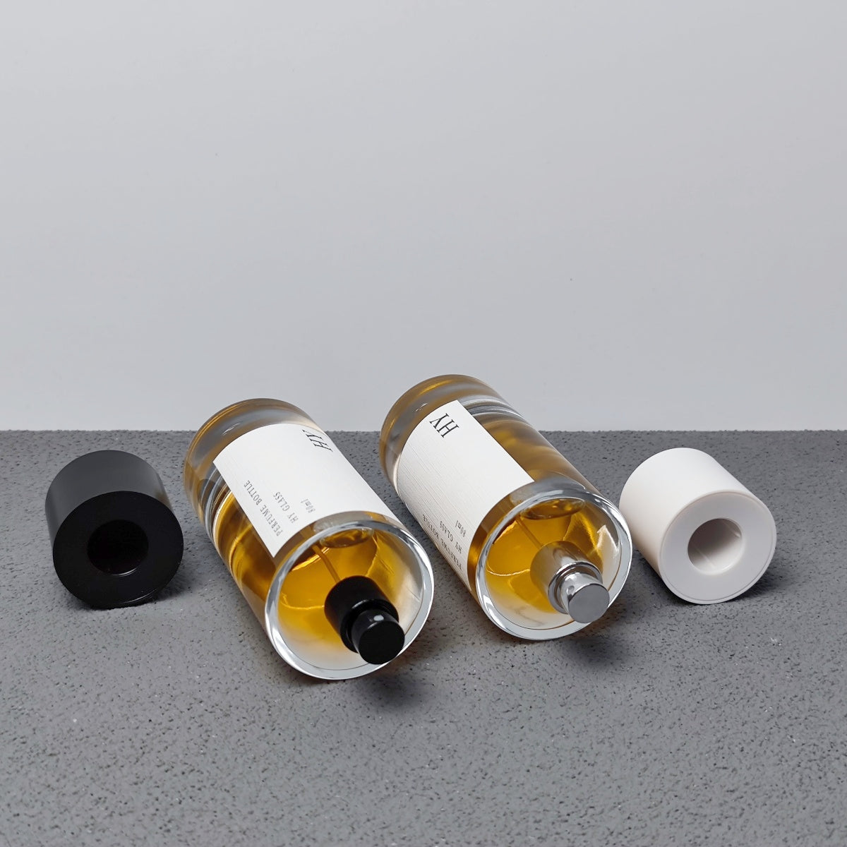 Custom 80ml Luxury Glass Transparent Cylinder Perfume Bottle Minimalist Black White Caps Screen Printing Pump Sprayer Wholesale