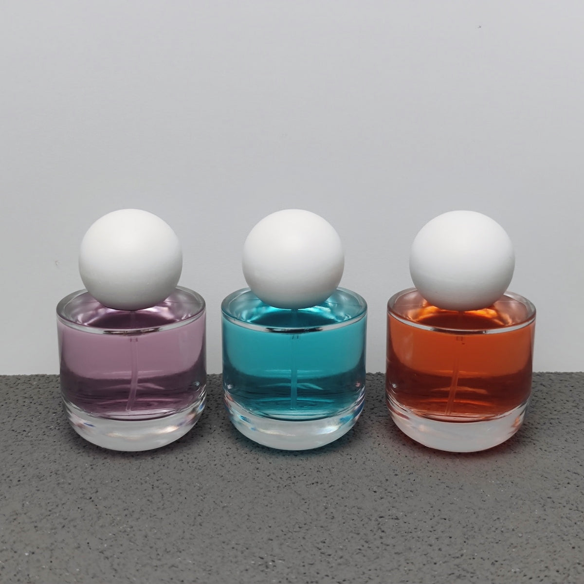 50ml & 100ml Cylinder Glass Perfume Bottles with Pump Sprayer and Stylish Caps for Home Boutique & Display