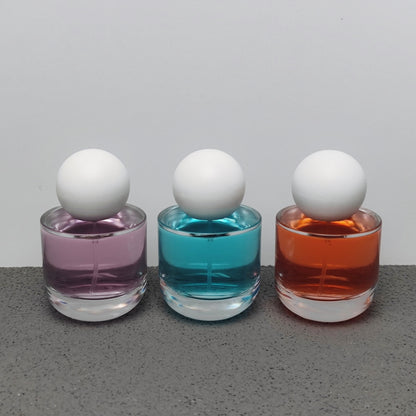 50ml & 100ml Cylinder Glass Perfume Bottles with Pump Sprayer and Stylish Caps for Home Boutique & Display