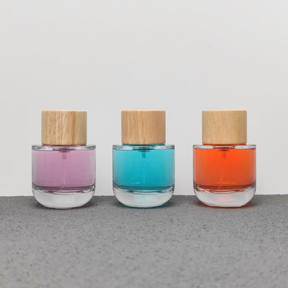 50ml & 100ml Cylinder Glass Perfume Bottles with Pump Sprayer and Stylish Caps for Home Boutique & Display