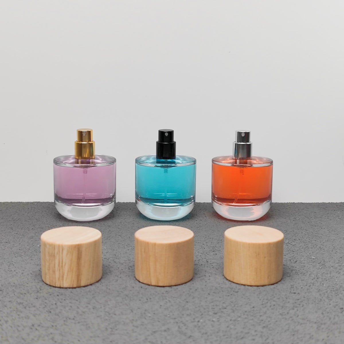 50ml & 100ml Cylinder Glass Perfume Bottles with Pump Sprayer and Stylish Caps for Home Boutique & Display