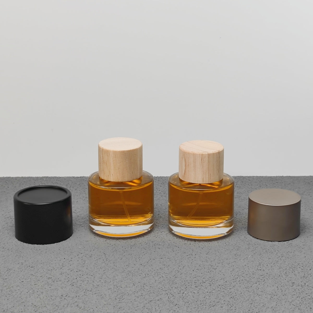 50ml Round Glass Perfume Bottle Crimp Neck Luxury Fragrance Packaging with Custom Cap OEM ODM Perfume Bottle Manufacturer