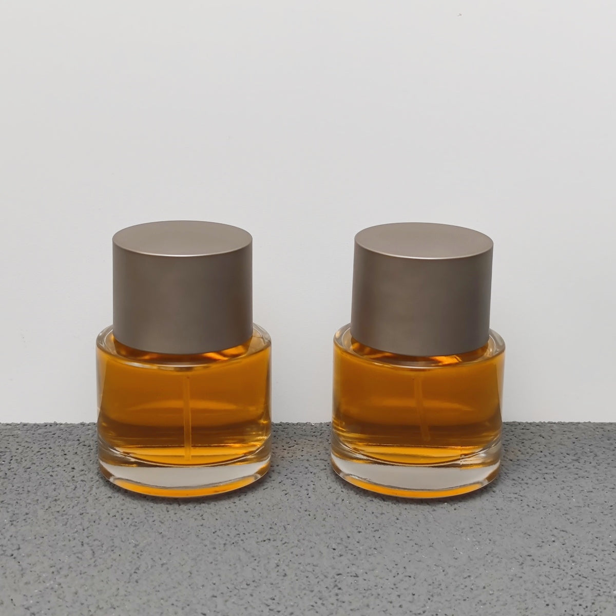 50ml Round Glass Perfume Bottle Crimp Neck Luxury Fragrance Packaging with Custom Cap OEM ODM Perfume Bottle Manufacturer