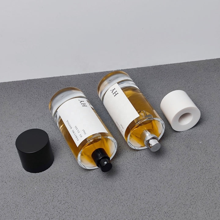 Custom 80ml Luxury Glass Transparent Cylinder Perfume Bottle Minimalist Black White Caps Screen Printing Pump Sprayer Wholesale