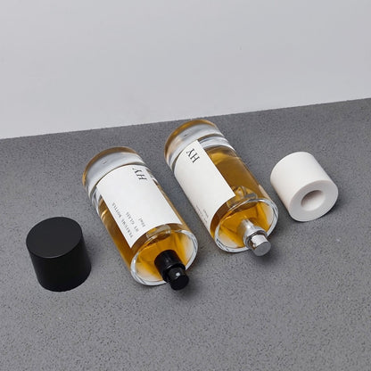 Custom 80ml Luxury Glass Transparent Cylinder Perfume Bottle Minimalist Black White Caps Screen Printing Pump Sprayer Wholesale