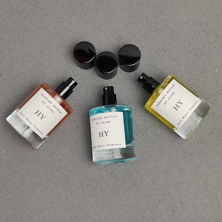 High Quality 50ml Minimalist Empty Glass Perfume Spray Bottle Crimp Neck and Black Cap with Pump Sealer