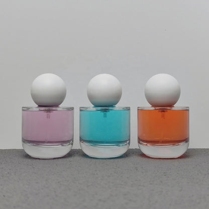 50ml & 100ml Cylinder Glass Perfume Bottles with Pump Sprayer and Stylish Caps for Home Boutique & Display