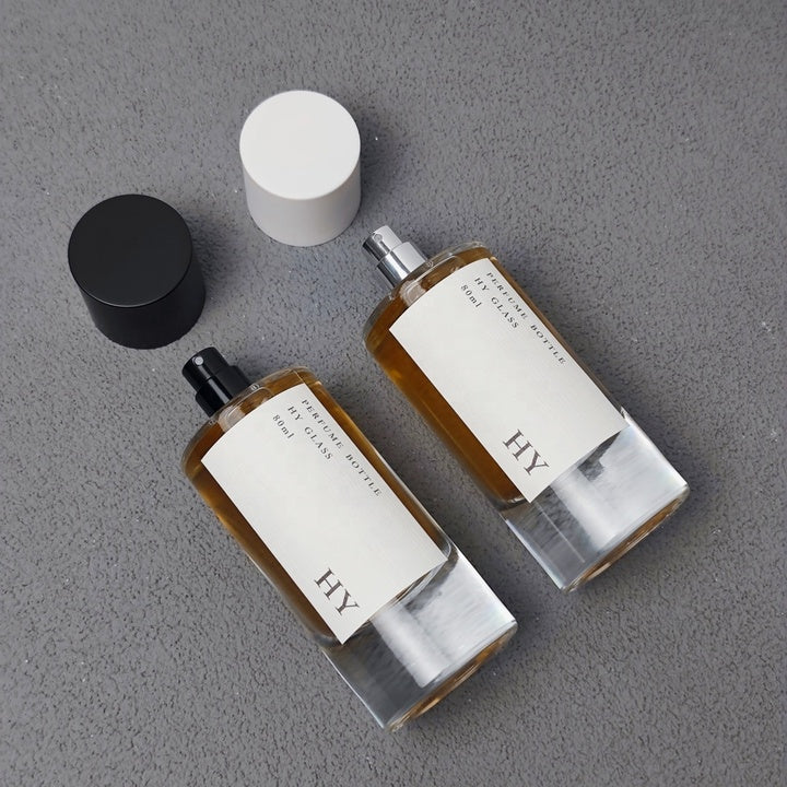 Custom 80ml Luxury Glass Transparent Cylinder Perfume Bottle Minimalist Black White Caps Screen Printing Pump Sprayer Wholesale