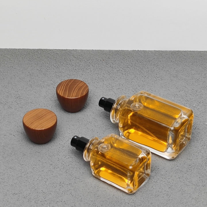 Luxury Unique Square Design 50ml 100ml Arabic Perfume Bottles with Crimp Atomizer and Wood Cap Screen Printing