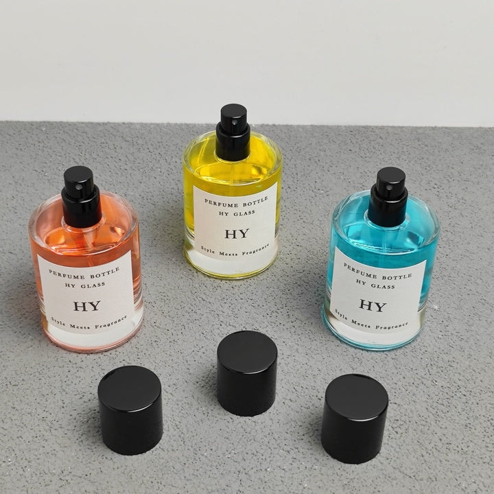 High Quality 50ml Minimalist Empty Glass Perfume Spray Bottle Crimp Neck and Black Cap with Pump Sealer