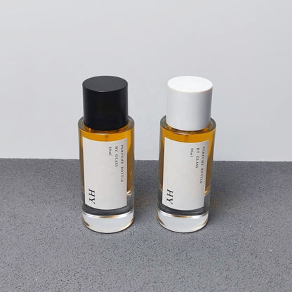 Custom 80ml Luxury Glass Transparent Cylinder Perfume Bottle Minimalist Black White Caps Screen Printing Pump Sprayer Wholesale
