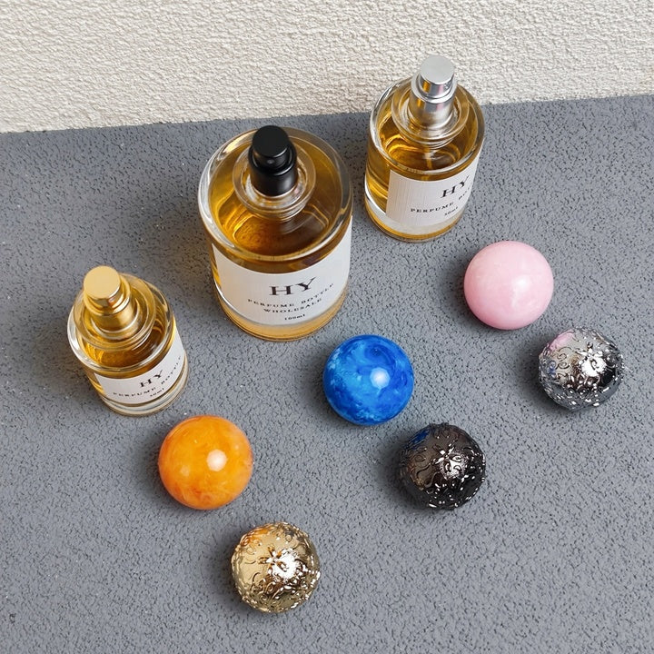 Wholesale Beautiful Neck Design 30ml 50ml 100ml Round Glass Luxury OUD Perfume Bottles with Colorful Resin Cap