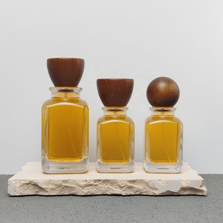 Luxury Unique Square Design 50ml 100ml Arabic Perfume Bottles with Crimp Atomizer and Wood Cap Screen Printing