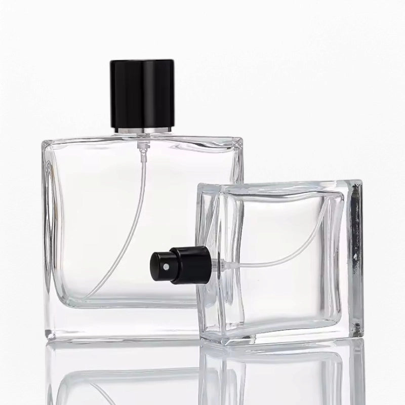 two clear square class perfume bottles