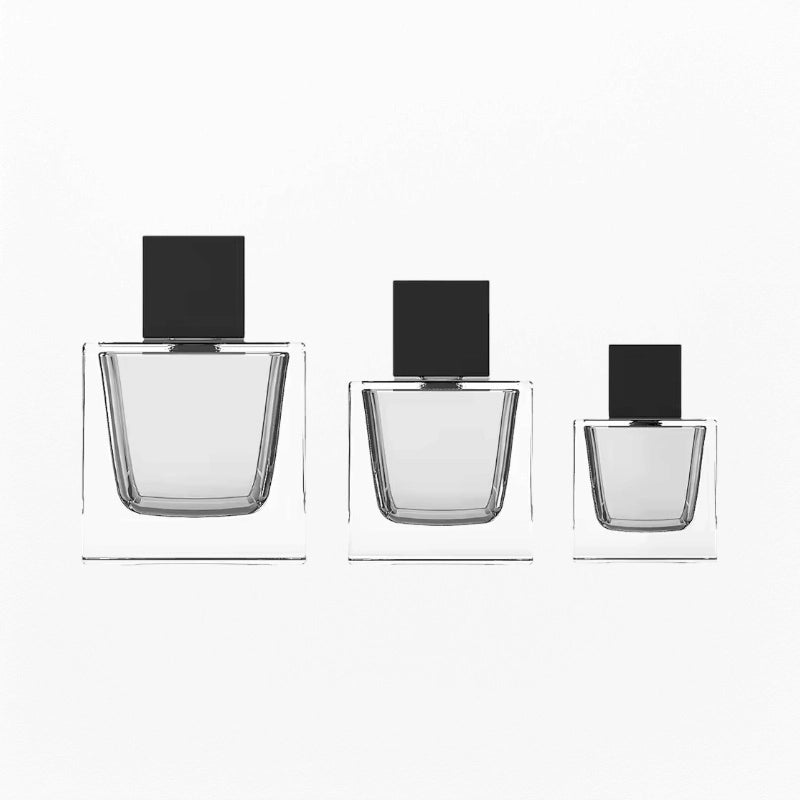 three cube perfume bottles clear glass material