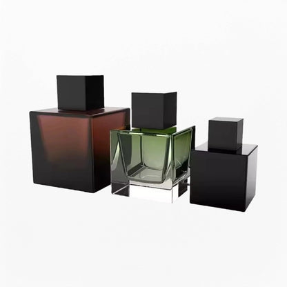 three cube perfume bottles with amber green and black color and black caps