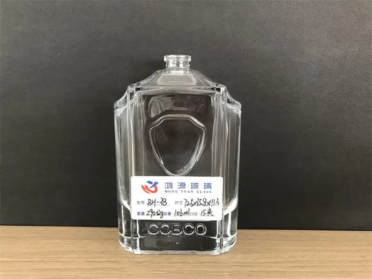 custom perfume bottle with a shield on the body