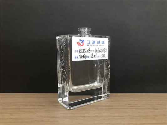 Flat square perfume bottle with custom pattern on the side