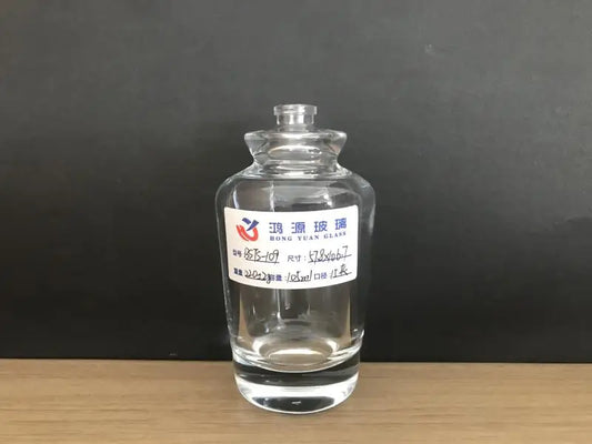 Cylindrical glass perfume bottle with specially designed shoulder