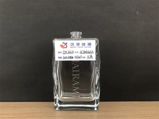 This is a specially shaped perfume bottle, which is generally square, but has a wavy design on the side edges. In addition, there is customer-customized text on the bottle.