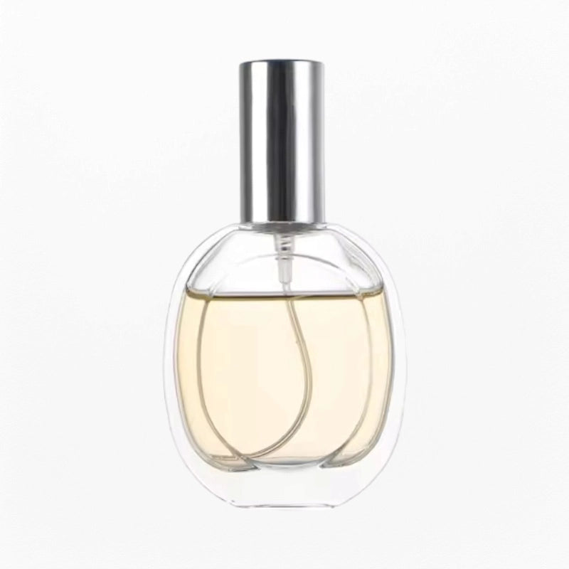 empty glass perfume bottle with silver cap