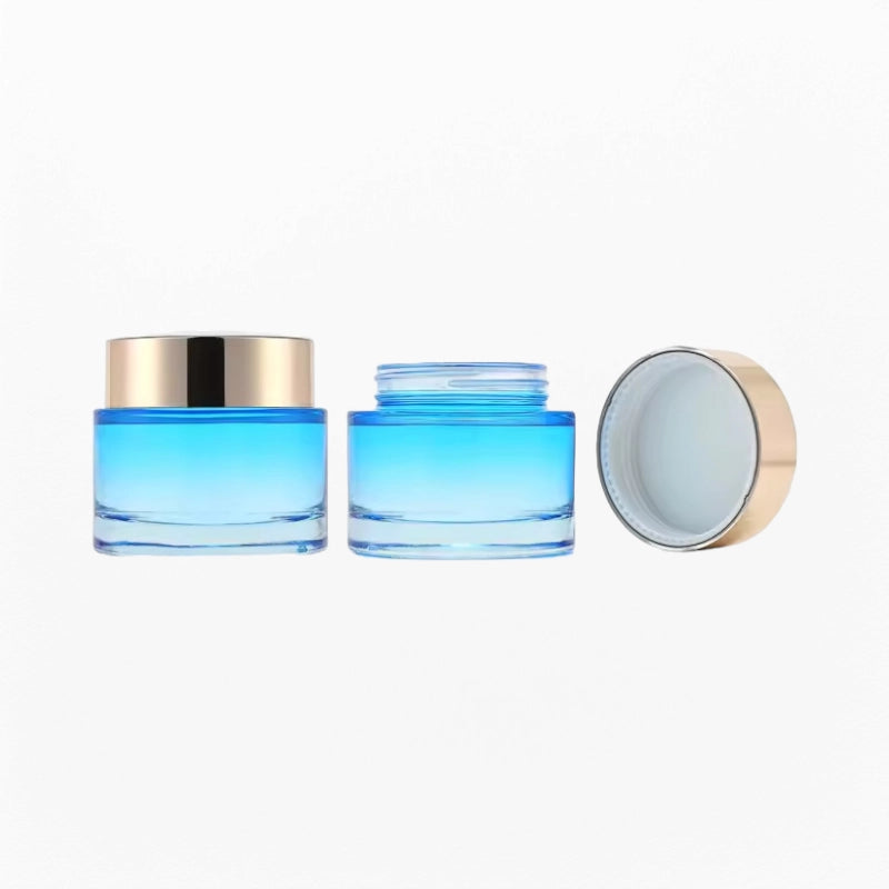 2 blue cream jars of different sizes