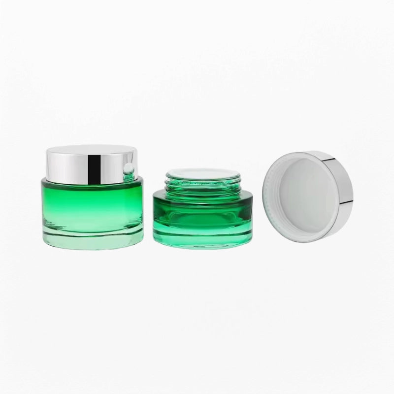 2 green cream jars of different sizes