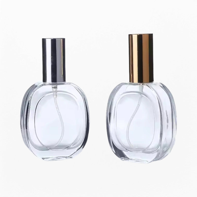 Two Refill Cologne Bottles Made From Clear Glass