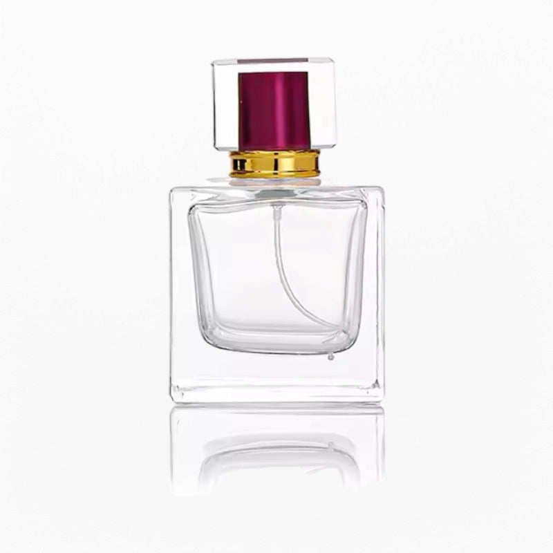 a perfume bottle with beautiful red cap