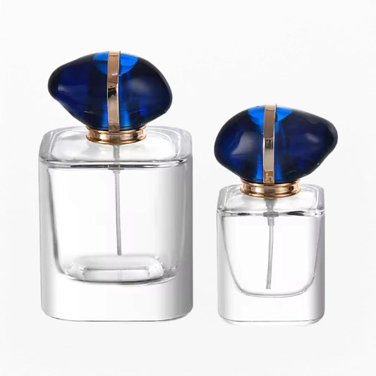 square perfume bottle with specially shaped blue bottle cap