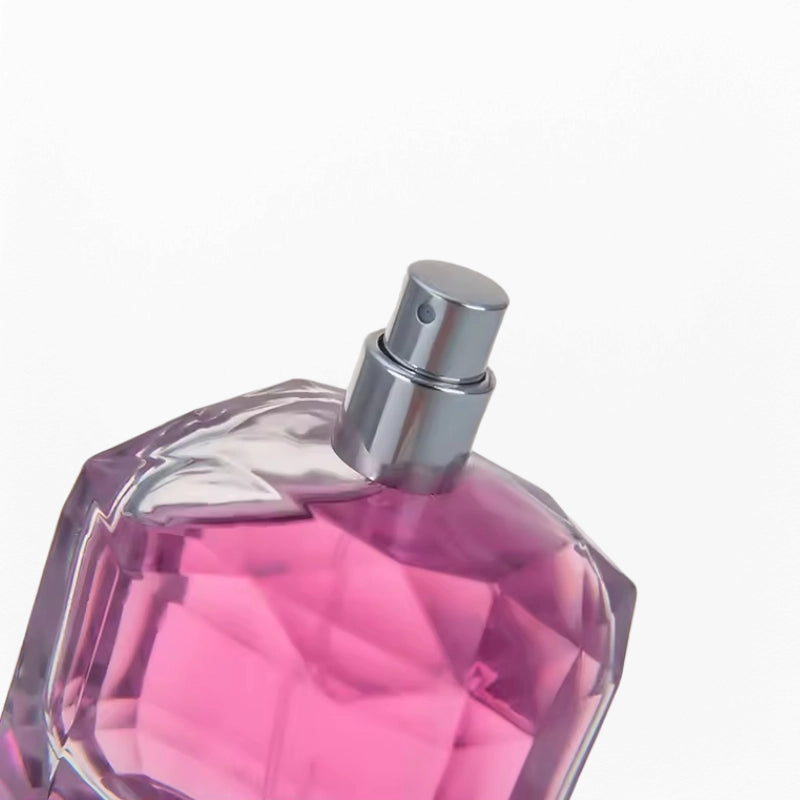 unique cube perfume bottle shoulder resembles a diamond cut with silver sprayer